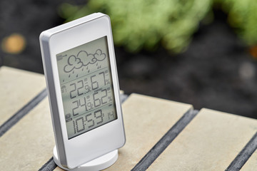 Wall Mural - Best personal weather station device with weather conditions inside and outside. Home digital weather forecast concept with temperature and humidity.