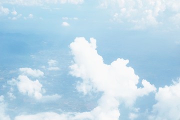 blue sky background with clouds, beautiful cloudscape, view over white fluffy clouds, freedom concept