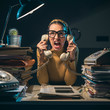 © stokkete - Stressed secretary shouting at the customers on the phone