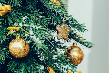 Wall Mural - Green fir tree with golden balls. Christmas wallpaper.