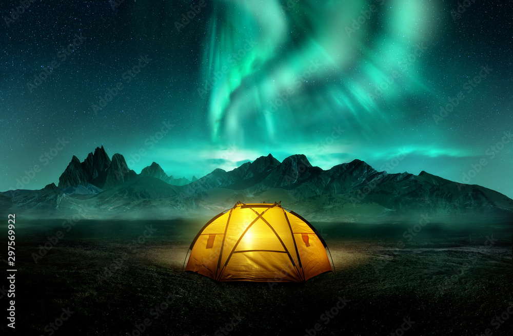 A glowing yellow camping tent under a beautiful green northern lights aurora. Travel adventure landscape background. Photo composite. - obrazy, fototapety, plakaty 