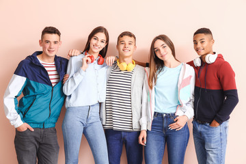 Canvas Print - Portrait of teenagers on color background