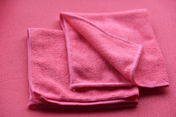 Poster - pink towels in a fold on a pink background