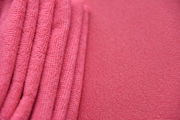 Poster - pink towels in a fold on a pink background