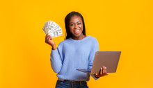 African American Young Woman Making Money From Internet, Using Laptop