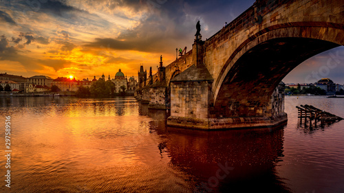Charles bridge (Karluv most) at sunrise, scenic view of the Old town with Old Town Bridge Tower, colorful sky and historic medieval architecture, Prague, Czech Republic Canvas Print