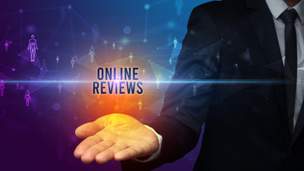 Elegant hand holding ONLINE REVIEWS inscription, social networking concept