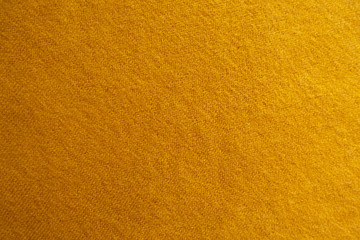 Wall Mural - Amber yellow knitted woolen fabric from above