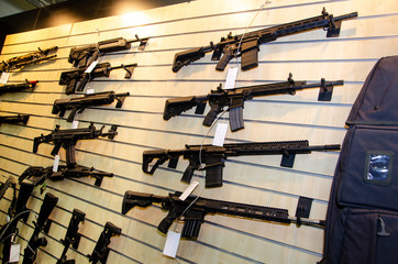 Gun wall rack with rifles