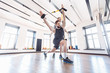 © Rithor - Male trainer teaches his student how to workout with suspended training system. Concept of strength training and work with the support of a coach