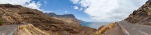 Panorama Of Costal Road GC 200 On Gran Canaria Winding Its Way Along The West Coast Of The Island. View Of Tamadaba National Park An The Atlantic Ocean On A Sunny Day.