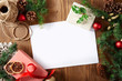 © virtustudio - Christmas greeting card with copy space on a wooden background viewed from above. Top view