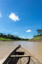 Inside View Of Rustic Wooden Motor Boat Sailing On Purus River In The Amazon On Sunny Summer Day With Trees On River Bank, Blue Sky And Clouds In The Background. Nature And Environment Concept.