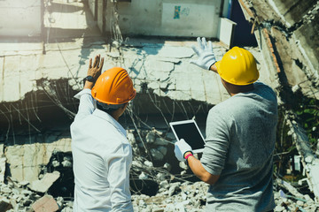 Wall Mural - Demolition control supervisor and contractor discussing on demolish building.