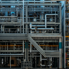 Wall Mural - Abstract industrial background. Pipeline, valves and vats