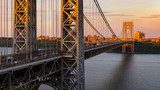 The George Washington Bridge (long-span suspension bridge) across the Hudson River at sunset. Uptown and Fort Washington Park, New York City, USA