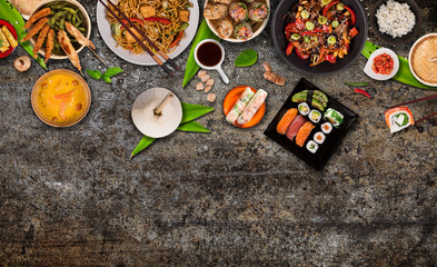 Wall Mural - Asian food background with various ingredients on rustic stone background , top view. Vietnam or Thai cuisine.