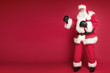 © neonshot - Happy Santa Claus wearing boxers gloves