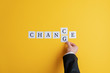 Hand of a businessman changing the word Chance into Change