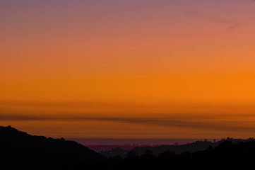 Wall Mural - Image of a smoke-polluted dusk sky, following a wildfire,  in Los Angeles looking west. 