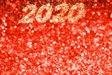 Wall Mural - Abstract composition. Christmas backgroudn, New 2020 year in golden glitter with beautiful bokeh on red