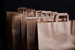 © Татьяна Кутина - Brown paper bags on a black background