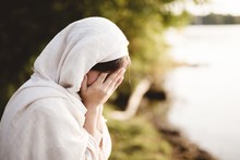 Closeup Shot Of A Female Wearing Biblical Robe Crying  - Concept Confessing Sins