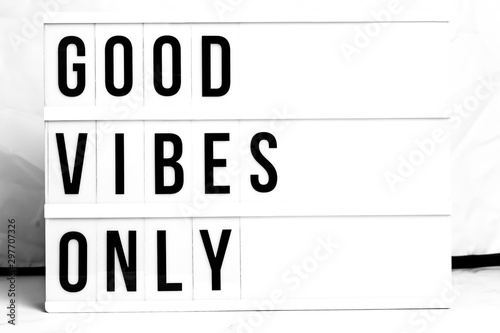 Inspirational Good Vibes Only quote on vintage retro board. Concept. flat lay
