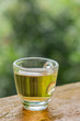 Hot tea in a clear glass placed on the table In the midst of natural atmosphere. is soft focus