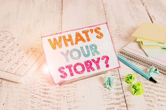 Text sign showing What S Is Your Storyquestion. Business photo showcasing analysisner of asking demonstrating about past life events Notepaper stand on buffer wire in between computer keyboard and