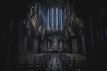 GLASGOW, SCOTLAND, DECEMBER 16, 2018: Magnificent Perspective View Of Interiors Of Glasgow Cathedral, Known As High Kirk Or St. Mungo, With Huge Stained Glasses. Scottish Gothic Architecture.