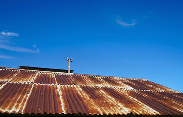 rusty roof with blue sky