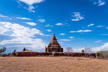 Ancient temple and pagoda in Bagan ,Myammar .This show Archaeological place of Myammar with blue cloud sky background.