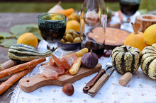 Autumn Picnic In The Park. Pumpkins, Pie, Prosciutto And Snacks. Bottle Of Wine And Glasses On A Wooden Table. Sunny Day And Outdoor Recreation.