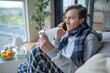 © zinkevych - Man wearing scarf speaking with doctor on phone