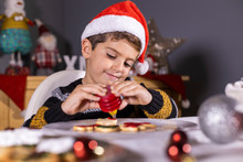 Cute Child Decorating Cookies On Cristmas Time