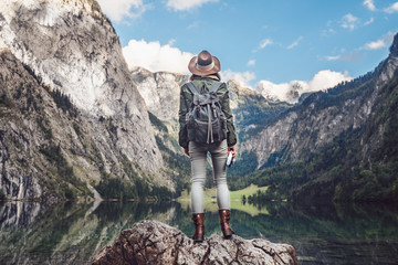 Wall Mural - Young photographer with a backpack outdoors