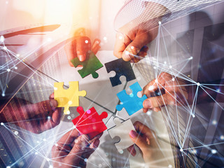 business team connect pieces of puzzles. teamwork, partnership and integration concept. double expos