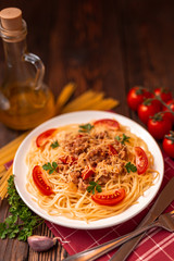 Wall Mural - Pasta bolognese with tomato sauce and minced meat, grated parmesan cheese and fresh parsley - homemade healthy italian pasta on rustic wooden background.