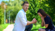 © motortion - Naive young woman admiring wedding ring in hand of ignoring boyfriend, relations
