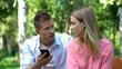 © motortion - Jealous husband shouting at wife looking through messages on phone, breakup