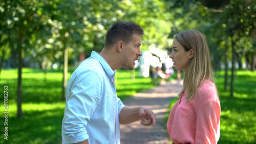 Fotografía Young couple arguing outdoor, family misunderstanding, emotional abuse, conflict