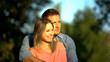 © motortion - Caucasian male hugging female enjoying togetherness outdoors, love closeness