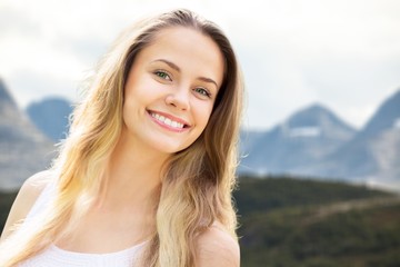 Wall Mural - Beautiful woman with a whiten perfect smile