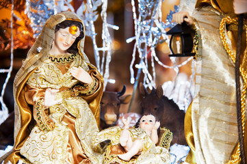 Nativity scene with the Virgin Mary, Baby Jesus, and St. Joseph figurines at home.