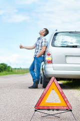 Wall Mural - Man on road near car and waiting help