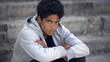 © motortion - Lonely african male teen looking camera, economical crisis, puberty age problem