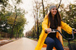 © cherryandbees - woman riding bike outdoor in park