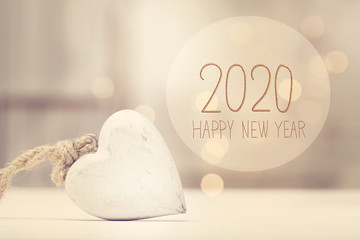 Wall Mural - New Year 2020 message with a white heart in a room