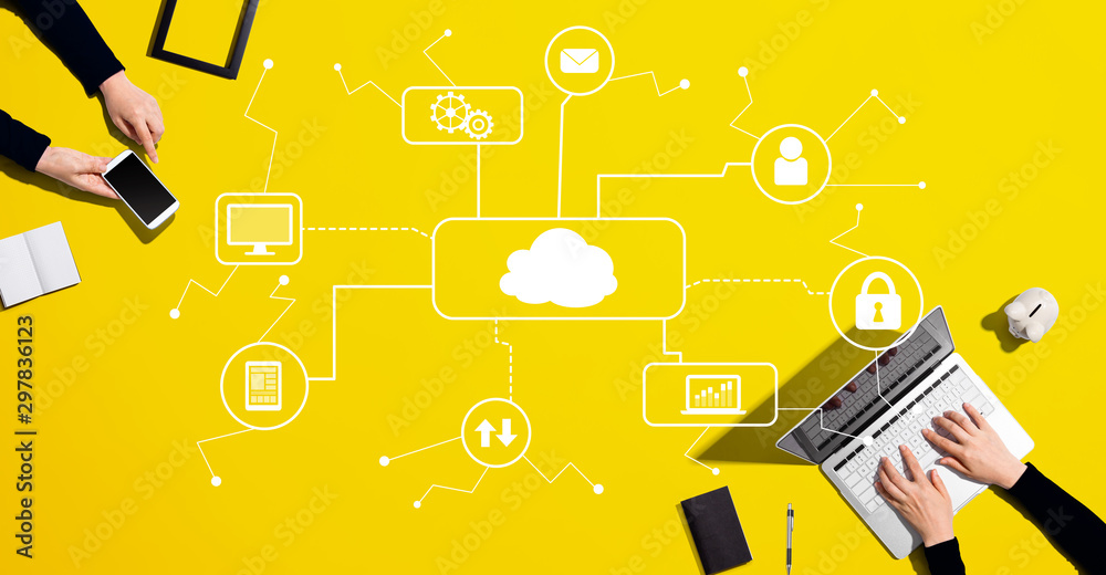Cloud computing with people working together with laptop and phone ...